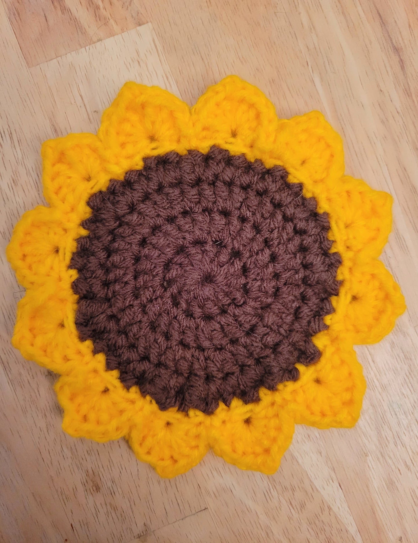Crocheted sunflower coaster