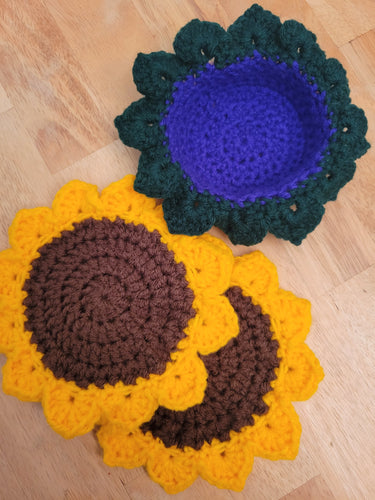 2 sunflower coasters and crocheted flower pot