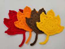 Load image into Gallery viewer, 1 red, 1 orange, 1 brown, 1 yellow fall maple leaf shaped crocheted coaster
