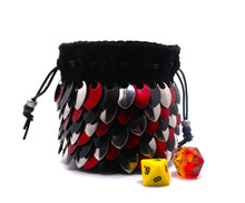 Load image into Gallery viewer, Dice bag with black, red, silver scales made from black yarn with a black drawstring closure
