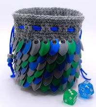 Load image into Gallery viewer, Dice bag made from gray yarn with blue, green, and graphite metallic dragon scales and a blue drawstring
