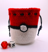 Load image into Gallery viewer, Dice bag crocheted with white, black and red yarn to look like a pokeball with a black drawstring closure

